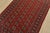 A tribal Bokhara rug hand-knotted with fine wool on a cotton foundation. This rug features rows of repeating medallions...