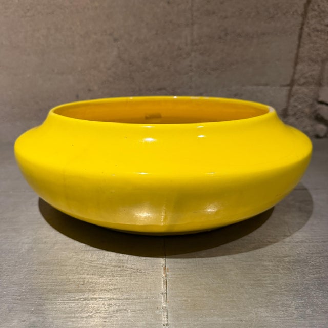 For your consideration, a vintage Mid-Century Modern "UFO" style yellow ceramic bowl, which commonly served as a florist's...