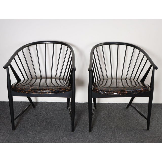 Pair of ebonized beechwood “Solfjädern” (Sunfeather) lounge chairs designed by Sonna Rosén in 1948 for Nässjö Stolfabrik,...