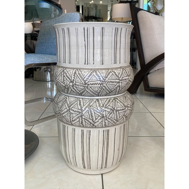 A set of two studio pottery vases made by Roy Hamilton, circa 1980s. These oversize vases have an unusual double cuff...