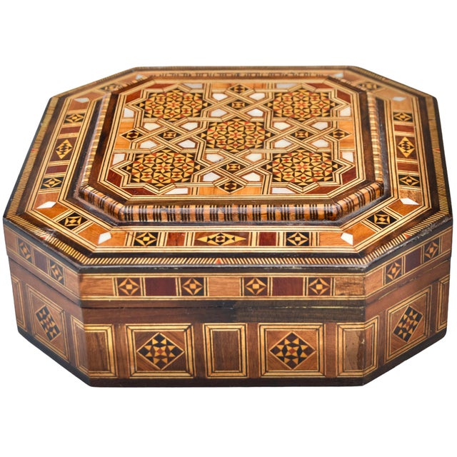 Gorgeous Mid-Century box featuring an intricate hand-carved solid walnut wood with remarkable Moorish Arabesque pattern,...