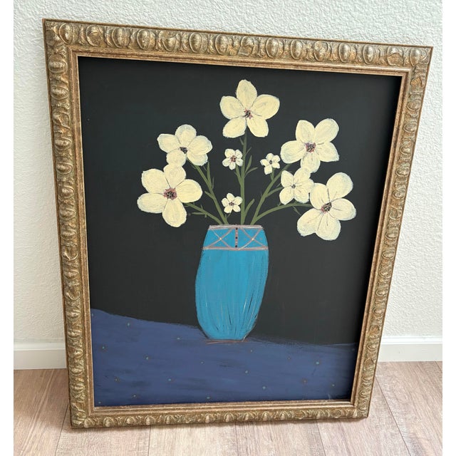Large primitive style whimsical framed painting of joyful flowers in a blue vase against a stark black background and...