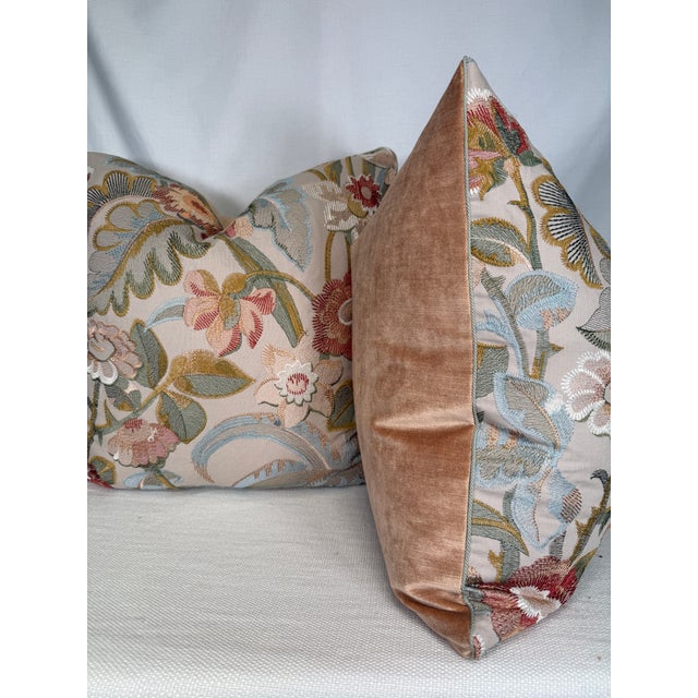 Custom pair of 22" pillows covered in Cowtan & Tout "Tapestry Flowers" in coral and backed in pale sienna velvet. These...