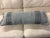 Design Plus Gallery presents the Textured Gray Bolster Pillow. The rectangular form is upholstered in a heathered gray...