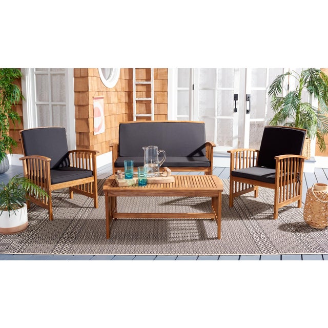 The open and airy design of the Rocklin 4 Piece Outdoor Set beautifully combines form and function. Its slatted silhouette...