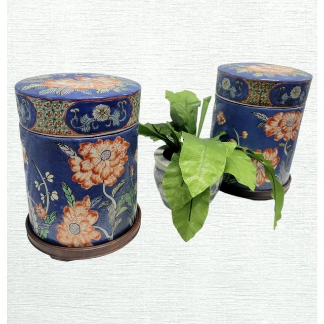 An incredible pair of very large ceramic blue and red floral cylindrical ginger jars. I love the unusual shape of these...
