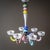 Glass chandelier composed of colorful glass elements with six chandelier arms in soft pastel tones. Please note: We assume...