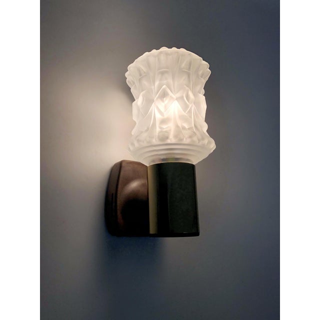 Pair of vintage Italian Targetti wall sconces in gold-tone metal with glass globes Pair of Italian Targetti wall sconces...