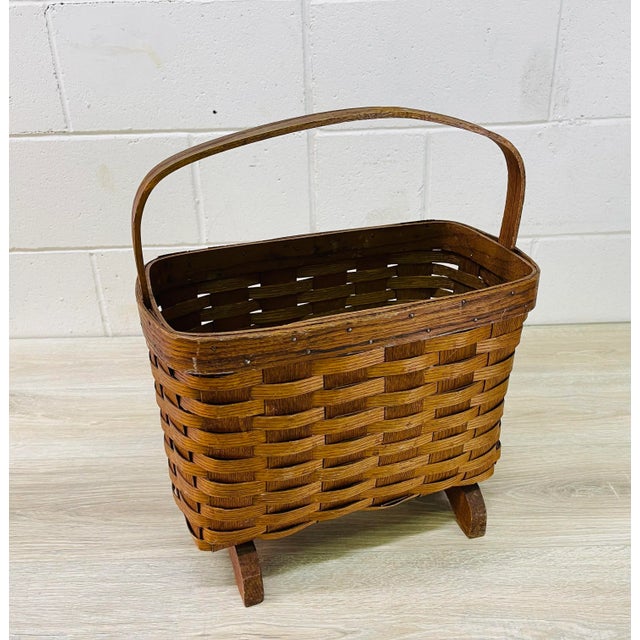 Vintage 1960s oak split wood handled magazine rack or basket with oak wood feet. The basket could serve as a magazine rack...