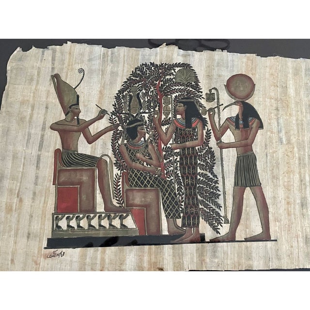 Vintage hand-painted papyrus created in Egypt, showcasing the Egyptian God Thoth — deity of the moon, wisdom, knowledge,...