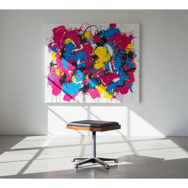 Mid-century swivel stool from the 1960s, featuring a teak frame and black leather seat. While the maker is unknown, the...