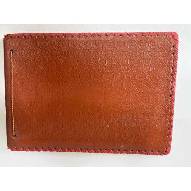 Moroccan Hand-Tooled Leather Photo Album with Fantasia Scene, circa 1940s A richly decorative vintage Moroccan photo...