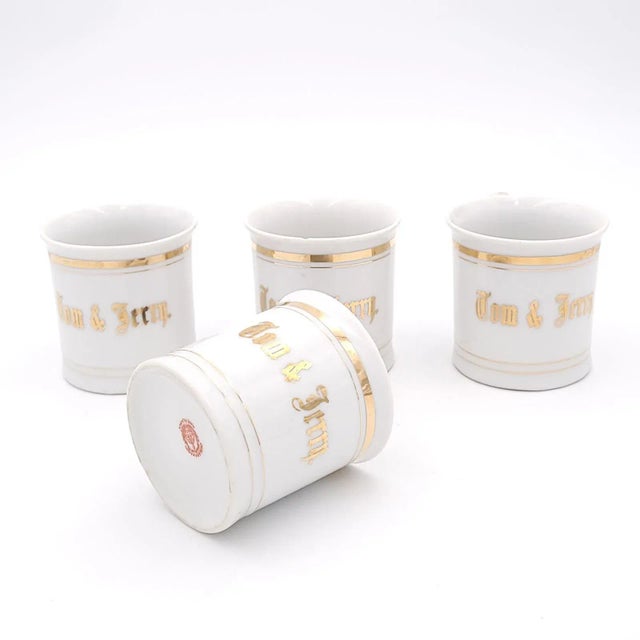 A set of four vintage coffee mugs with gilding, Japan circa 1900. Chip to one rim.