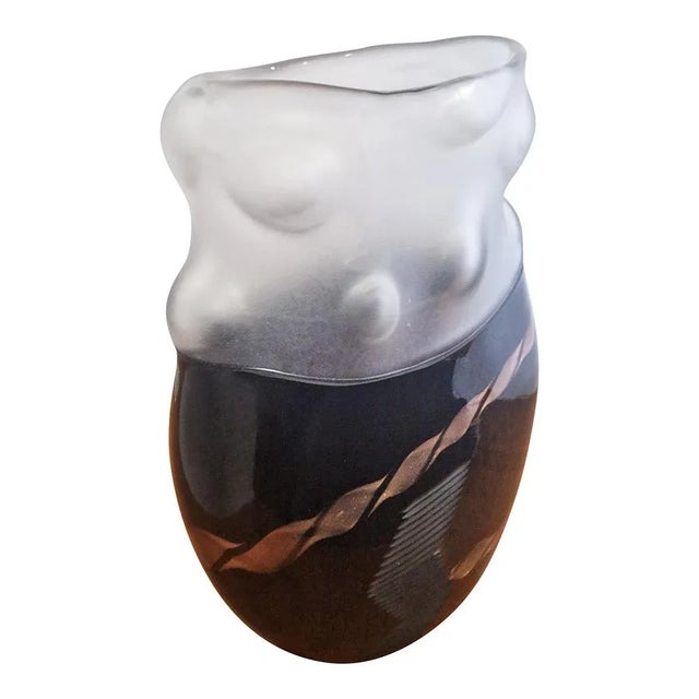 The vase signed "Colizza Murano" was made, according to tradition, by master glassmakers inside the Murano furnaces, in...