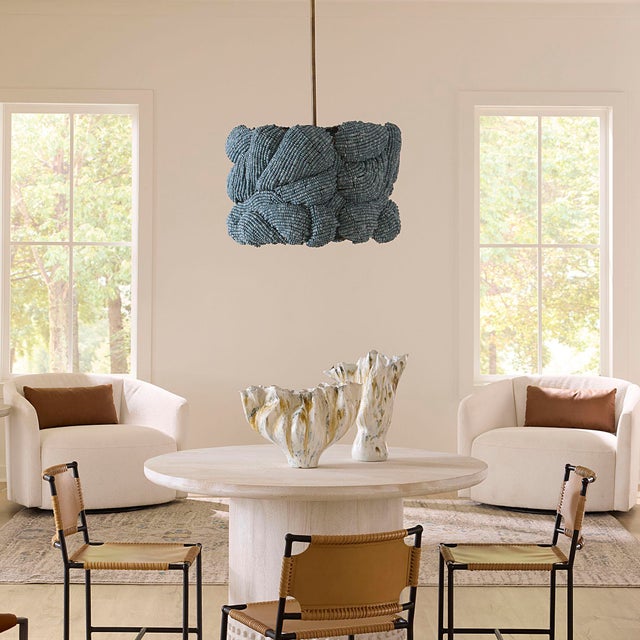 Expertly handcrafted from blue mango wood beads and antique brass, this chandelier introduces a harmonious balance of...