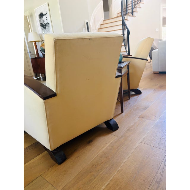 Every piece of antique furniture tells a story, but this exceptional pair of 1930s French Art Deco club chairs carries its...