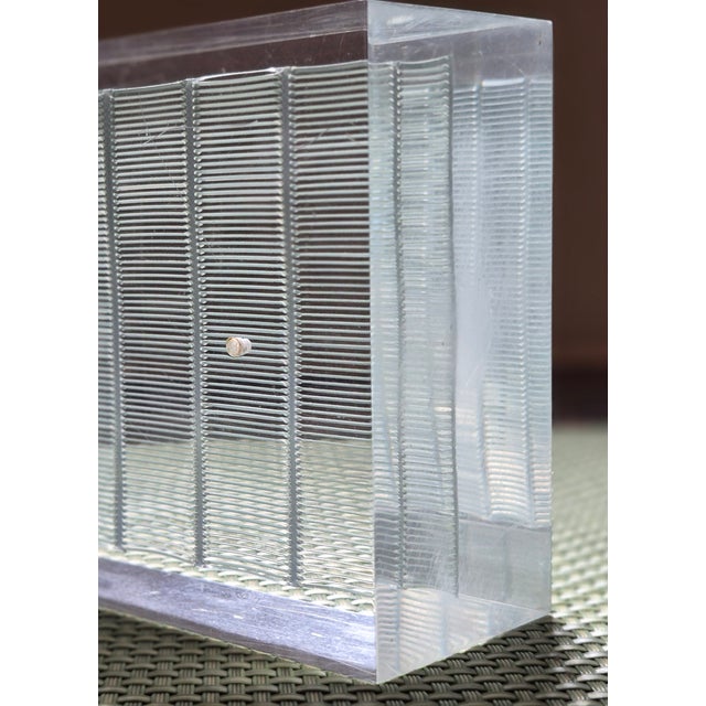 Sculpture by Jesus Rafael Soto (1923-2005) Sculpture by Jesus Rafael Soto (1923-2005) This luminescent block of Plexiglass...