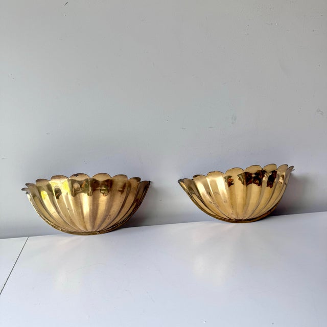 Vintage pair of scalloped brass regency style wall pocket planters.