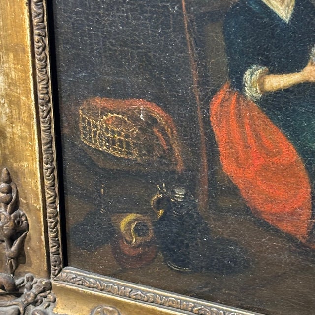 Antique painting of an interior scene, 18th century, “woman with spinning wheel”, flemish oil on canvas in an antique...