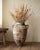 An authentic 19th Century Mediterranean terracotta olive jar with a beautifully weathered surface and remnants of its...