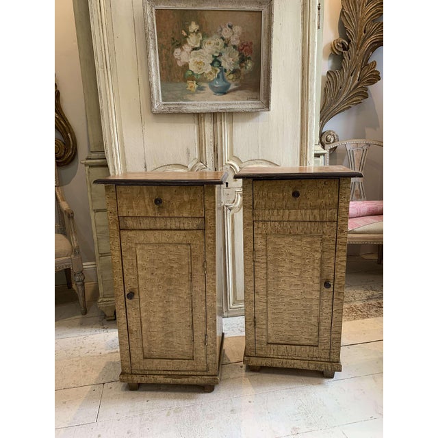 A nice a useful pair of bedside cabinets that retain the original faux Bois painted effect in birch and birds eye maple....