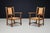Pair of French Oak and Rush Armchairs in the Manner of Charles Dudouyt, France, 1940s A beautiful and characterful pair of...