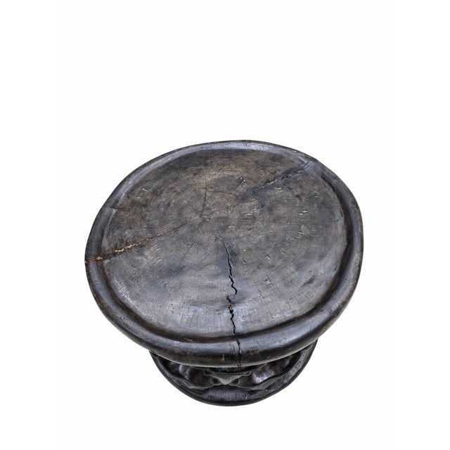 Vintage Tribal Carved African Hardwood Stool/Side Table Hand-carved African hardwood stool featuring a cylindrical form...