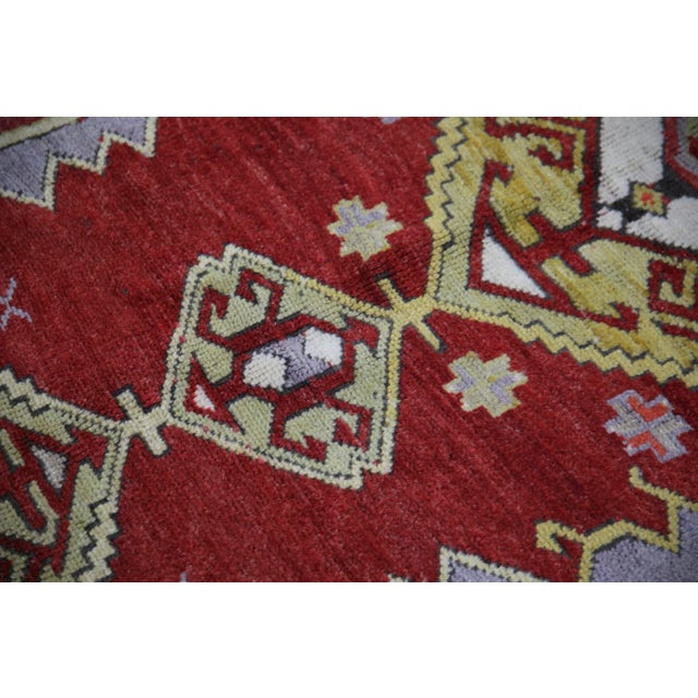 Introducing a one-of-a-kind vintage Turkish hand-knotted wool rug, carefully crafted by skilled artisans using traditional...