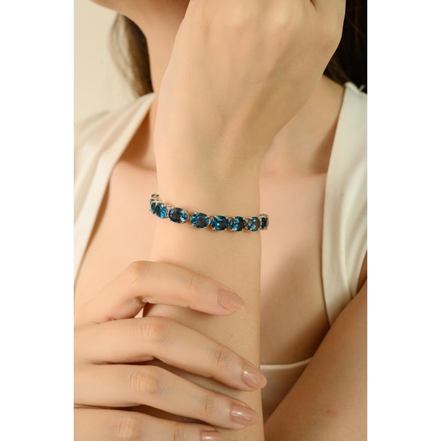 This luxurious London blue topaz gemstone bracelet is expertly crafted from 925 solid sterling silver, providing a...