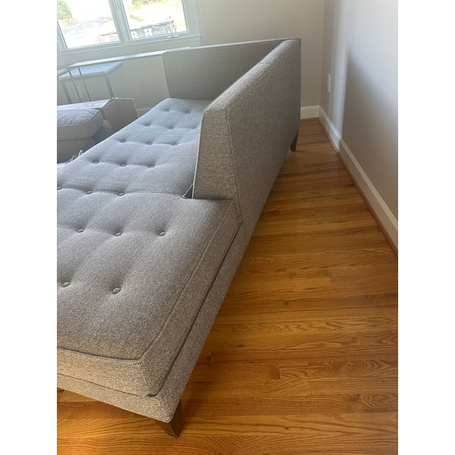 Stylish and versatile modern sofa with a chaise-style design. Upholstered in a neutral fabric that fits easily with many...