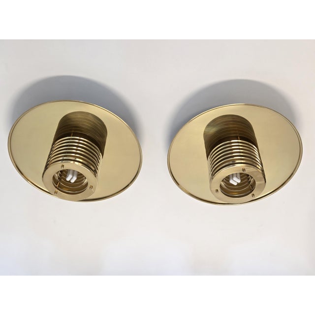 Brass/white ceiling lights, 2 pieces, manufactured by Swedish Fagerhult. The lights are in good used condition and the...