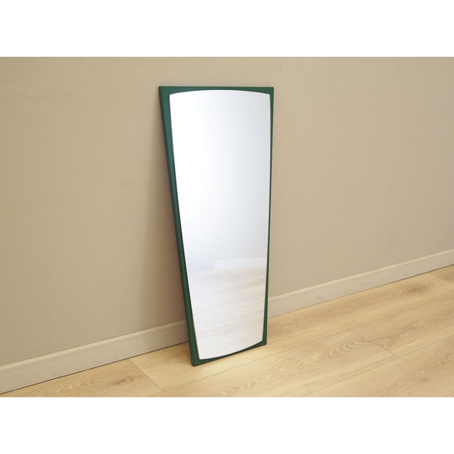 The mirror was made in the 1970s, Danish production. The frame of the mirror is made of solid pine wood stained green. The...