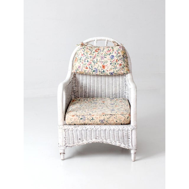 This early 20th-century wicker lounge chair combines the airy ease of painted porch furniture with the tailored lines of...