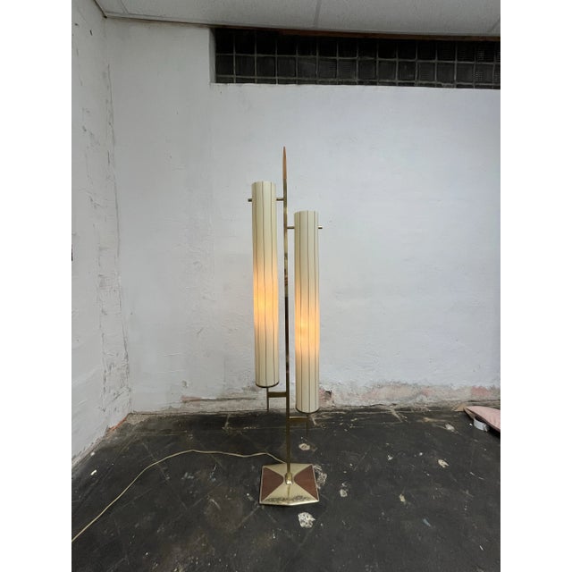 Fabulous mid century floor lamp in the manner of Tommi Parzinger, Gerald Thurston and Laurel Lamp. Brass with wood...