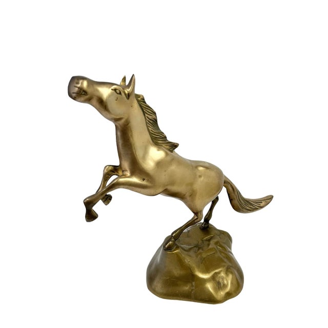 Add a touch of brass to your decor scheme with this vintage rearing horse. This wonderful sculpture is lightly polished...