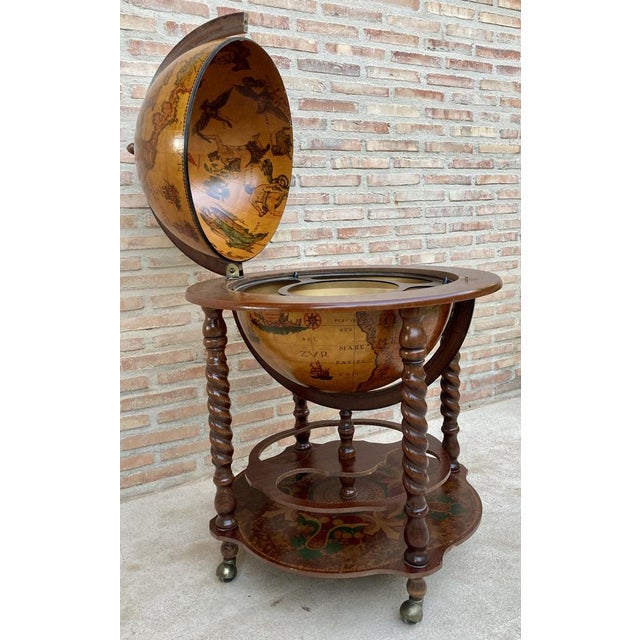 This vintage 1960s Italian dry bar is perfect for adding a touch of classic European flair to your home. The globe design...