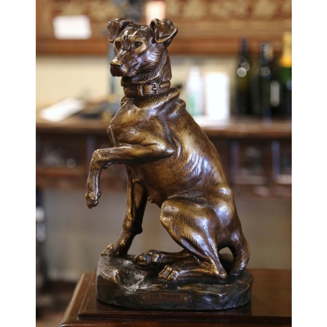 This beautifully executed, antique terracotta figure was sculpted in France, circa 1920. The sculpture sits on a dark...