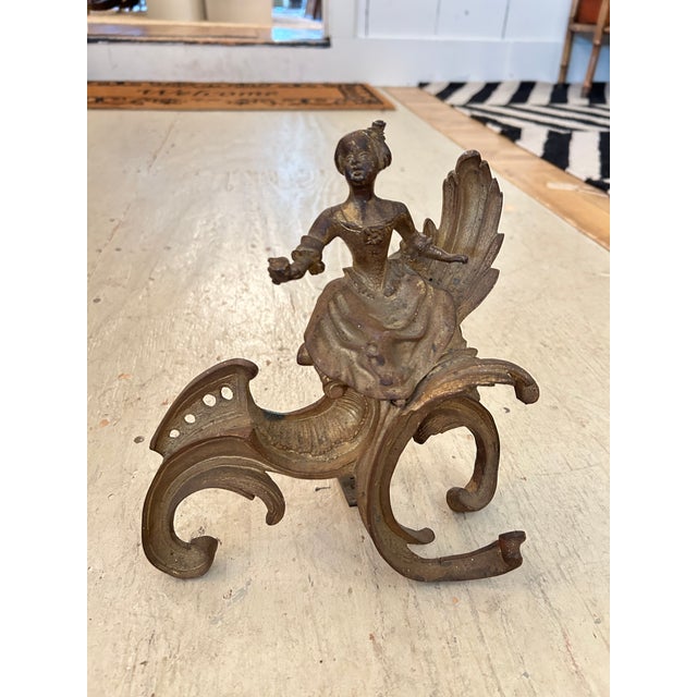 Lovely antique brass figural andirons having a male and female in wonderful poses.