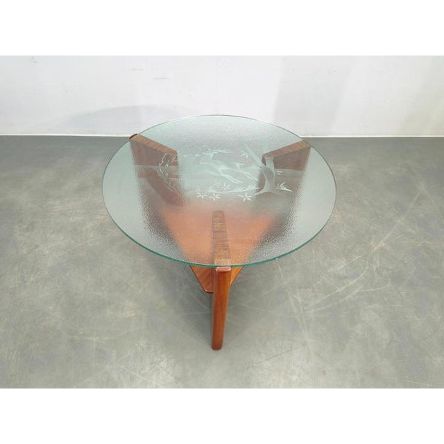 Elegant danish mid century round coffee table, denmark, 1960s. Executed in teak wood and veneer, the piece features a...