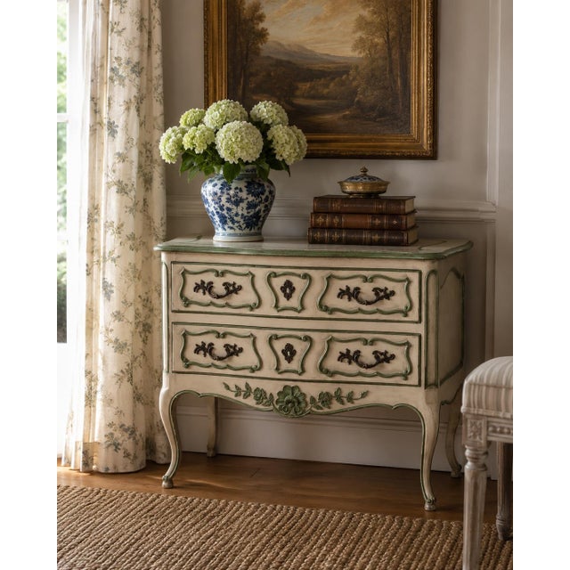 There is something particularly charming about mid-century American interpretations of French furniture, and this Bodart...