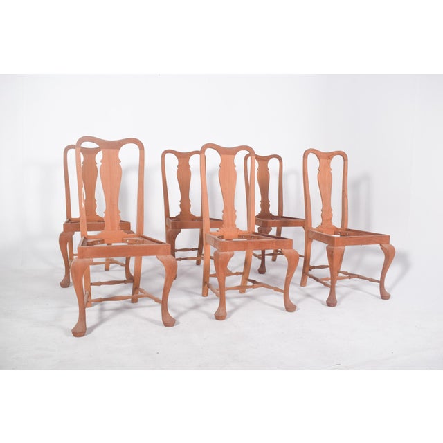 Six reproduction chairs, est. Queen Anne. High-backed, with openwork backrest and central “vase” cutout, characteristic of...