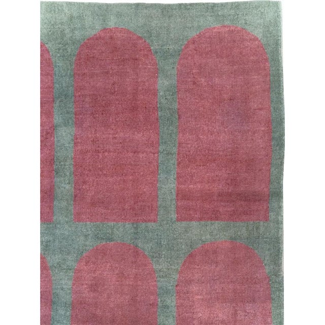 This Mid-20th century Turkish Art Deco Style room-size carpet presents a disciplined composition of fifteen elongated arch...