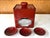 A Japanese lacquered Sake Drinking set circa late 19th century (end of Meiji period), The assemble consists of a red...
