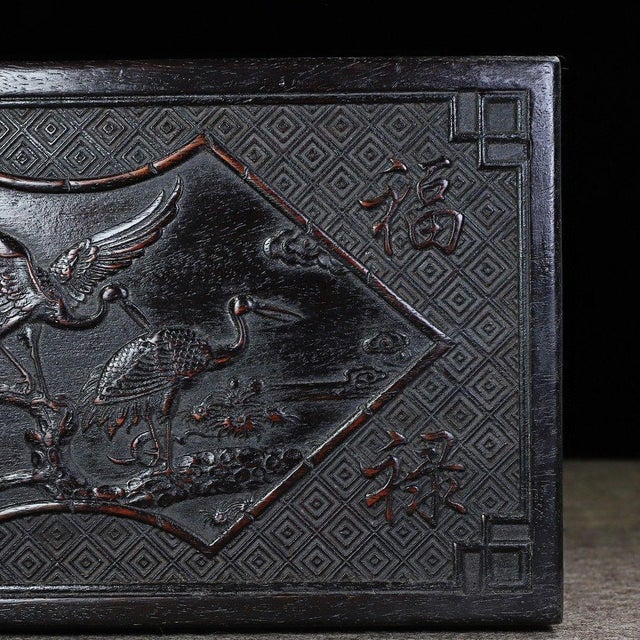 Add a touch of traditional Eastern craftsmanship to your home with this exquisitely carved wooden box. Featuring a large...