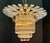 Very unusual circa-1990s brass and Lucite Art Deco Revival chandelier crowned with a two-tiered starburst. Takes 7...