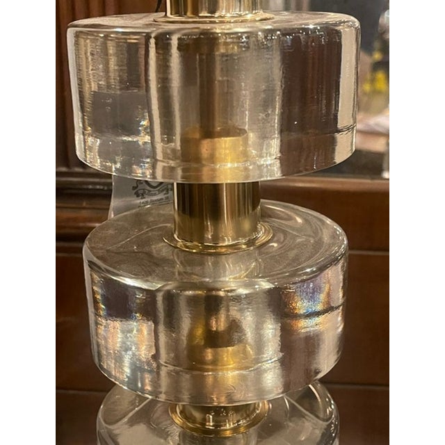 These lamps are a stylish and elegant addition to any home. The Murano clear glass discs paired with brass accents create...