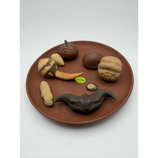 Yixing is best known for the famous zisha or purple sand teapots. It is safe to say all but a few potters, past and...