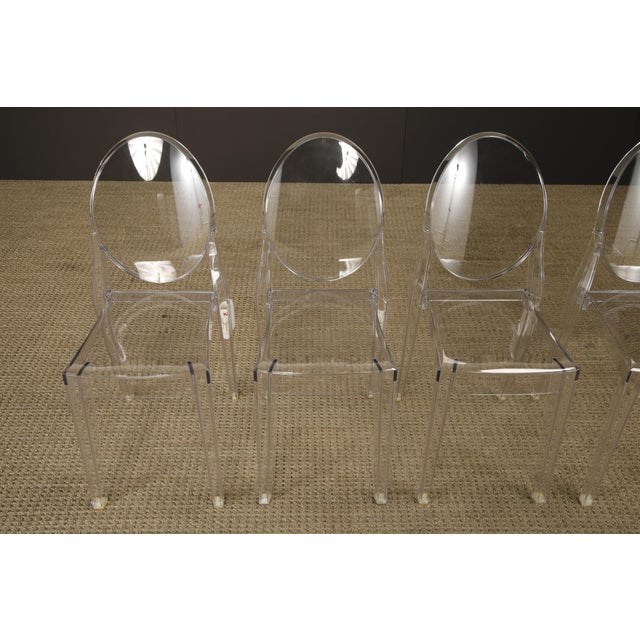 Iconic set of five Victoria Ghost chairs, designed by Philippe Starck for Kartell and celebrated for their seamless blend...