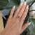 A rich red star ruby cabochon reveals a shimmering six-rayed star across its dome in this striking ring, accented with...