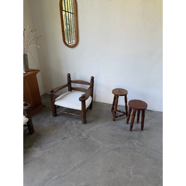 Antique pair of dark patinated oak stools. we love this unique set, composed of two stools, one slightly taller than the...